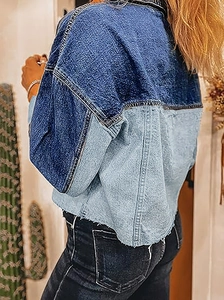 Detailed side view of long sleeve patchwork denim jacket with frayed hem and buttons