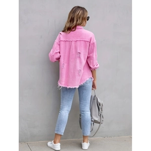 Pink distressed denim jacket for women featuring back ripped details and frayed hem