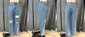 Three-way view of light blue wide-leg jeans featuring distressed knee holes and high waist