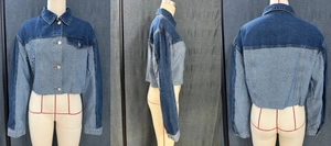 Detail of color-block cropped denim jacket with frayed hem and button-up front pockets