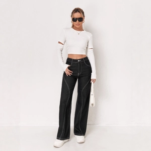 Women's black wide-leg cargo jeans with white contrast stitching and trendy pockets