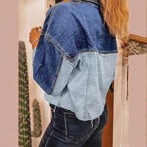 Women's cropped patchwork denim jacket with frayed hem and two-tone blue back view