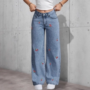 High waist light blue wide-leg jeans with red cherry embroidery and industrial background