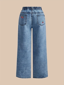 Detailed back view of wide-leg jeans with red cherry embroidery and elastic high waist