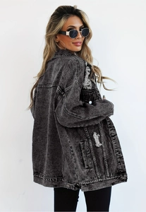 Detailed view of heavy washed grey denim jacket with distressed ripped back details