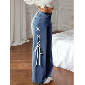 Women's high waist blue wide leg jeans with side lace-up ribbon detail and elastic fit