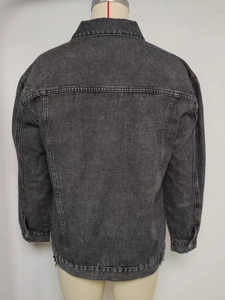 Back view of a loose-fit washed grey denim jacket with drop shoulders and adjustable tabs