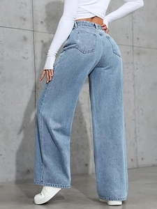 Rear view of light blue high-waisted wide-leg jeans showing back pockets and fit