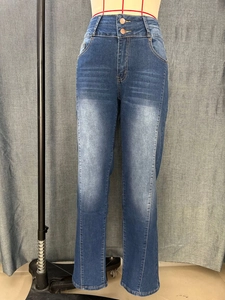 Close-up of high-waist dark blue straight jeans featuring double button closure and whiskers