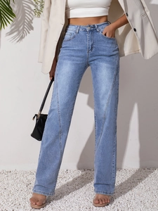 Detail of light blue high waist jeans with unique V-shaped stitching and straight leg cut