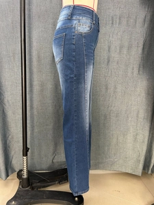 Close-up of classic blue straight-leg jeans featuring vintage wash and 5-pocket detail