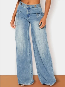 Detail of high waisted wide leg jeans with metal eyelet decor and large pockets