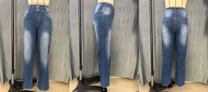 Detail view of high-waist straight-leg jeans with vintage double-button and faded wash