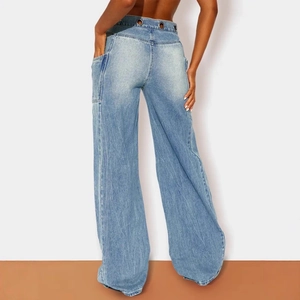 Women's light blue high-waisted wide-leg jeans with metal eyelets and cargo pockets