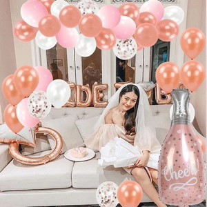 Rose gold bridal shower balloon set featuring Cheers bottle and diamond ring foil balloons