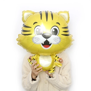 Cute cartoon tiger foil balloon for Chinese New Year decorations held by a model