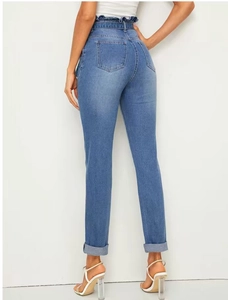 Detail of paperbag waist design and back pockets on sky blue elastic denim trousers