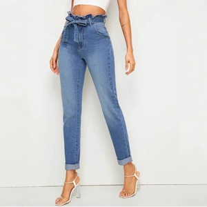 Women's light blue high waist jeans with ruffle waist and decorative bow tie detail