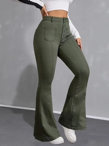 Close-up of olive green flare pants featuring a multi-button waist and retro stitching
