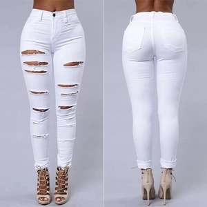 Women's white distressed skinny jeans featuring ripped details and a push-up fit