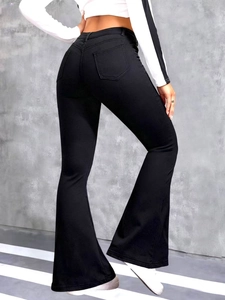 Rear view of high-waisted black flare jeans with slim fit and lift-up back pockets