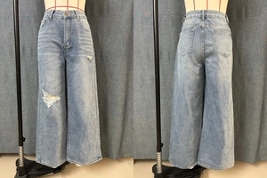 Detailed front and back view of light blue wide-leg jeans with ripped denim texture