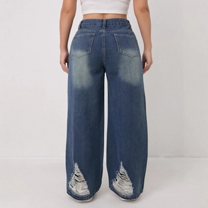 Retro gewassen blauwe wijde jeans met distressed franjes aan de achterzoom dames