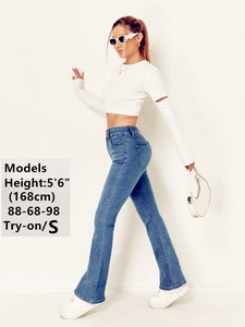 Detailed view of light blue flared jeans with model size info for fit reference