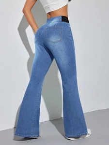 Women high waisted flare jeans in medium wash blue with elastic waistband slim fit style