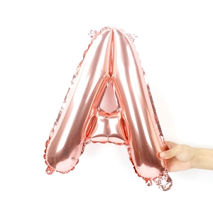 Detail of rose gold foil letter A balloon with metallic texture for party decor
