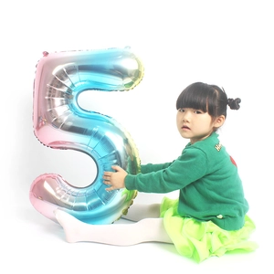 32-inch rainbow gradient number 5 foil balloon held by a child for birthday decoration