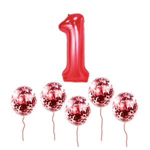 Detail of red number 1 foil balloon with five transparent red sequin confetti balloons