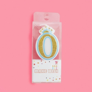 Pink and gold number 0 birthday candle with crown decoration in retail packaging