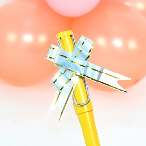 Yellow fountain pen with a gold-trimmed blue bow on the clip for gift packaging