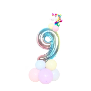 Macro shot of gradient number 9 balloon set with mini unicorn and macaron balloons