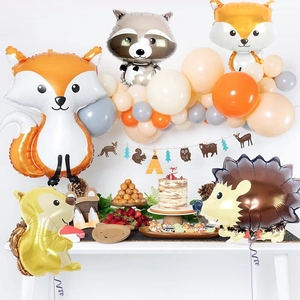 Detail of forest animal balloon set featuring fox and raccoon for birthday party decor