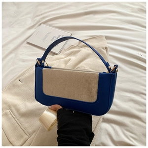 Detail of Klein blue leather and tweed patchwork on this stylish small box shoulder bag