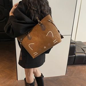 Cute cartoon cat tote bag in brown suede leather with spacious interior and handles