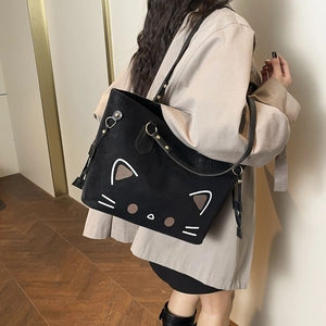 Cute cartoon cat patterned black leather tote bag with a spacious interior for women
