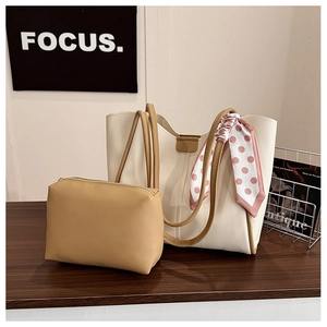 Detail of white tote bag with polka dot scarf handle and matching inner pouch set