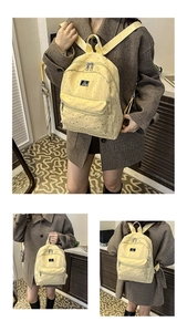 Detailed views of yellow canvas school backpack with star prints and adjustable straps