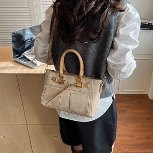 Beige canvas and brown leather kelly bag with gold hardware for office commuting