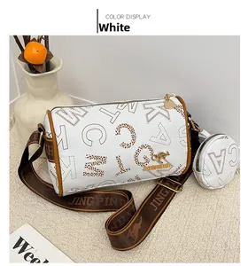 Detail of white cylinder Boston bag with leopard print logo and wide shoulder strap