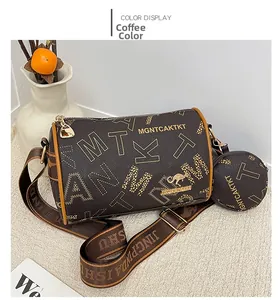 Detail view of coffee brown Boston bag with kangaroo logo and detachable round coin purse