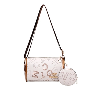 White Boston cylinder bag with monogram prints, brown straps, and matching coin purse