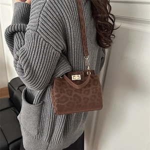 Brown leopard print small square bag with gold twist lock and long shoulder strap