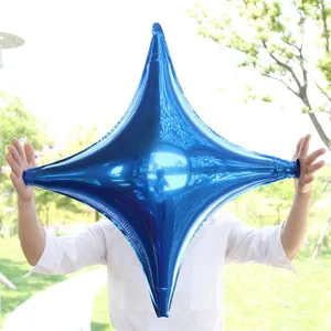 Close-up of a 26-inch blue four-pointed star foil balloon with a glossy metallic finish