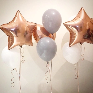 Rose gold foil star and latex balloon bouquet for birthday party decor with ribbons
