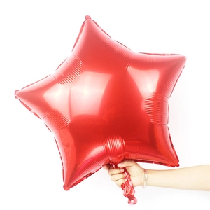 Detail of a 24-inch red star-shaped foil balloon with glossy metallic finish for parties