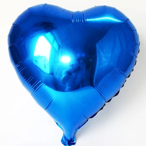 Macro shot of 18 inch bright royal blue heart shaped foil balloon with metallic luster